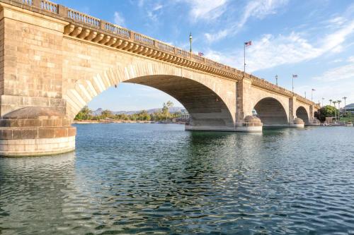 a stone bridge over a river with water at Super 8 by Wyndham Lake Havasu City in Lake Havasu City