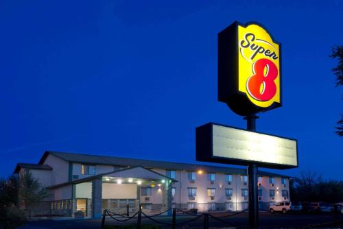 a sign for a super restaurant in front of a building at Super 8 by Wyndham Cortez/Mesa Verde Area in Cortez