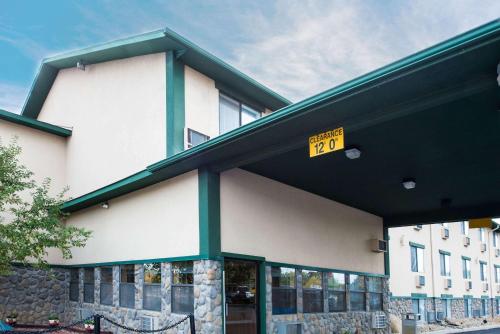 a building with a sign on the front of it at Super 8 by Wyndham Cortez/Mesa Verde Area in Cortez