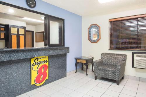 a waiting room at a super restaurant at Super 8 by Wyndham New Castle in New Castle