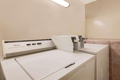 a white sewing machine sitting on top of a counter at Hillside Inn & Suite in Martinsburg