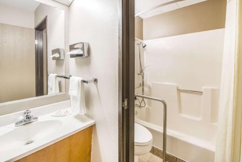 a bathroom with a sink and a toilet at Super 8 by Wyndham Nevada in Nevada