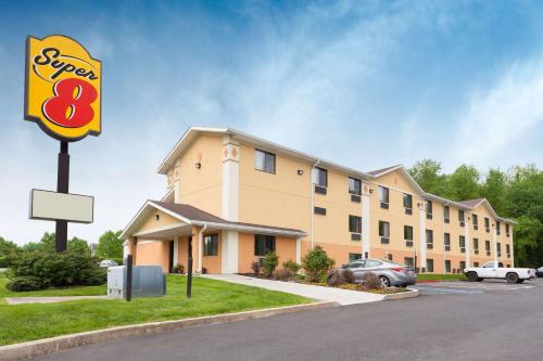 a hotel with a sign in front of a building at Super 8 by Wyndham Havre De Grace Aberdeen Area in Havre de Grace