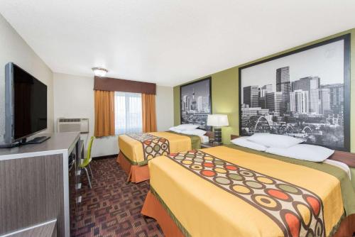 Katil atau katil-katil dalam bilik di Super 8 by Wyndham Moberly MO