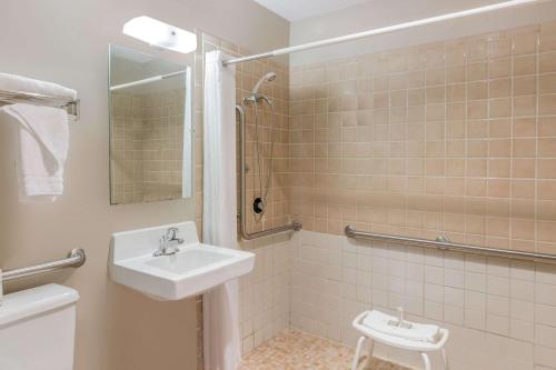 a bathroom with a sink and a shower at Super 8 by Wyndham Madison in Madison