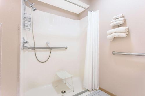 a bathroom with a shower and a toilet at Super 8 by Wyndham Austin MN in Austin