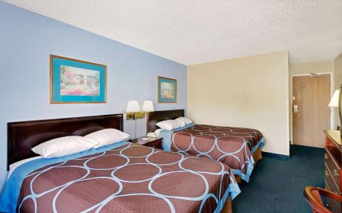 a hotel room with two beds in a room at Super 8 by Wyndham Newburgh/West Point Stewart Intl Airport in Newburgh