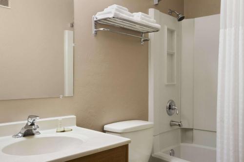 a bathroom with a sink and a toilet and a shower at Super 8 by Wyndham Port Angeles at Olympic National Park in Port Angeles