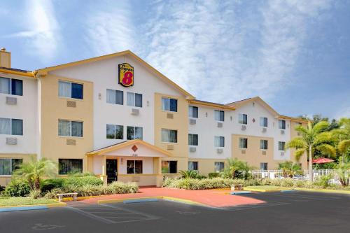 a rendering of a hotel with a parking lot at Super8 by Wyndham NEARBY Clearwater St Petersburg International Airport in Clearwater