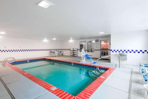 a pool in a hotel room with a swimming pool at Super 8 by Wyndham Fernley in Fernley