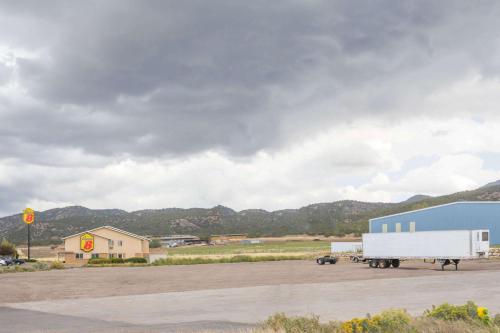 a white semi truck parked in a parking lot at Super 8 by Wyndham Nephi in Nephi