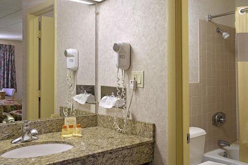 A bathroom at Days Inn by Wyndham Oak Ridge Knoxville