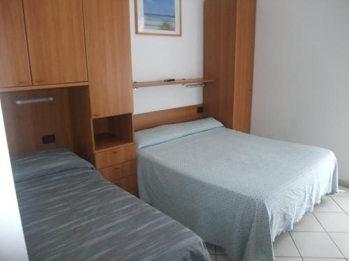 Letto o letti in una camera di Hotel Adriana