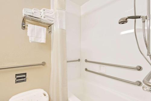 a bathroom with a shower and a toilet at Days Inn by Wyndham Washington in Washington
