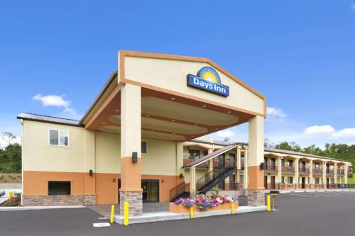 a front view of a hotel with a sign on it at Days Inn by Wyndham Fultondale in Fultondale