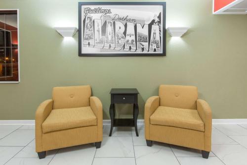 a waiting room with two chairs and a table at Super 8 by Wyndham Dothan in Dothan