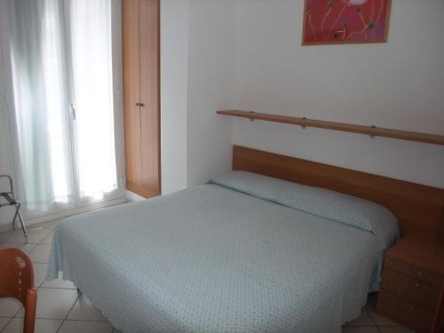 Letto o letti in una camera di Hotel Adriana
