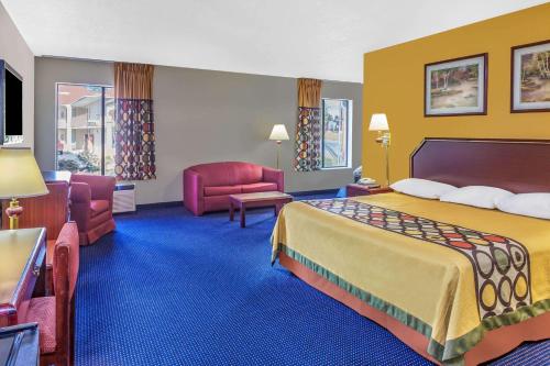 Ένα ή περισσότερα κρεβάτια σε δωμάτιο στο Super 8 by Wyndham Morristown/South