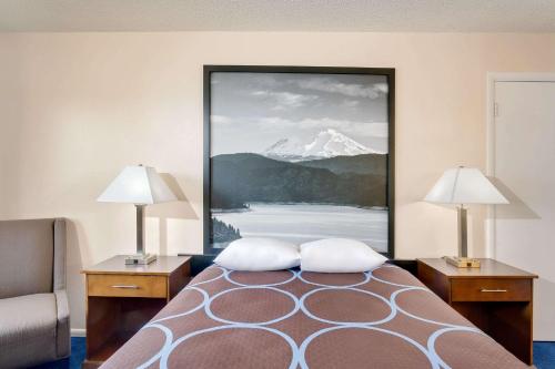 a hotel room with a picture of a snow covered mountain at Super 8 by Wyndham Alturas in Alturas