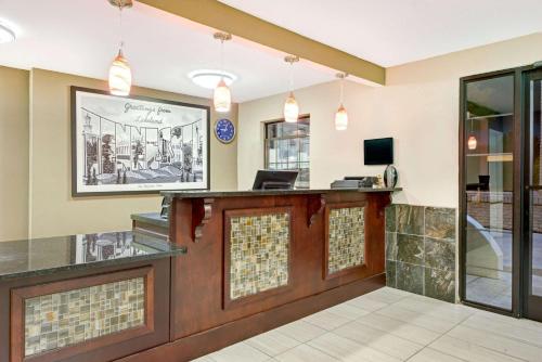an office with a lobby with a reception desk at Super 8 by Wyndham Lakeland in Lakeland