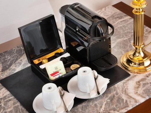 a briefcase sitting on a table next to a lamp at Radisson Blu Hotel Altstadt in Salzburg