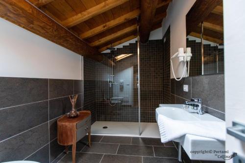 a bathroom with a sink and a shower at Portami in Collina in San Martino Buon Albergo