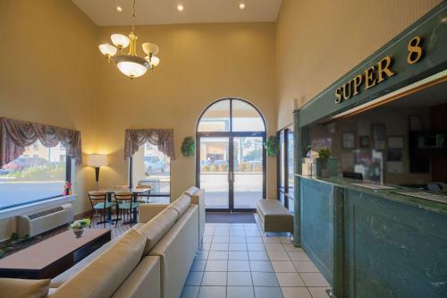 a fast food restaurant with a counter and tables at Super 8 by Wyndham Hammond in Hammond