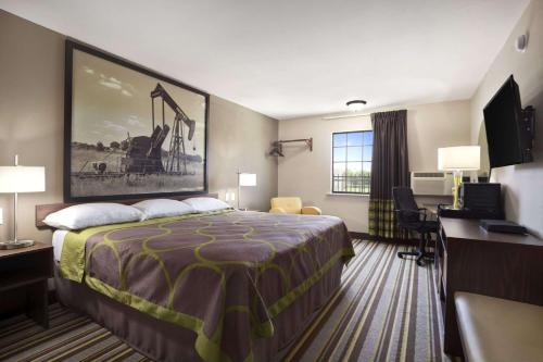 Ένα ή περισσότερα κρεβάτια σε δωμάτιο στο Super 8 by Wyndham Ardmore