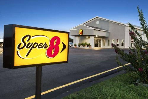 a super sign in front of a store at Super 8 by Wyndham Ardmore in Ardmore
