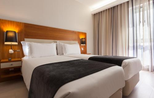 
Cama o camas de una habitación en Hotel Mercure Lisboa
