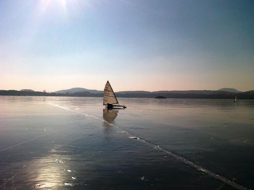 a small sail boat on a body of water at U Leknínu in Doksy