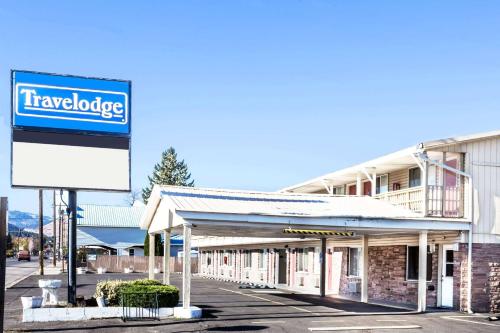 a travelodge building with a sign in front of it at Travelodge by Wyndham La Grande in La Grande