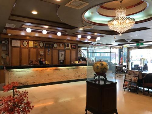 a lobby with a large marble counter in a restaurant at Sunrise Hotel in Tainan