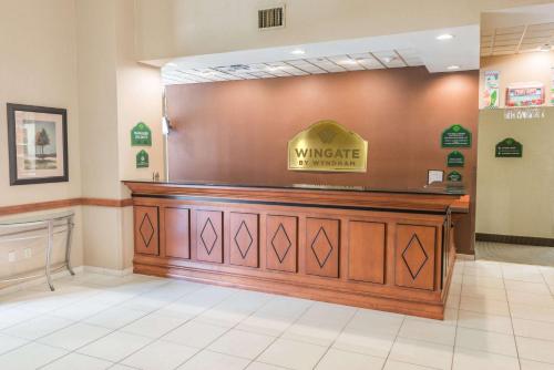 a wyncote pharmacy with a sign on the wall at Wingate by Wyndham New Braunfels in New Braunfels