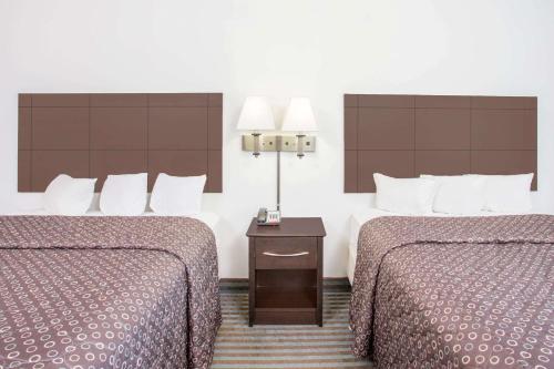 Cama o camas de una habitación en Super 8 by Wyndham Cedar Falls