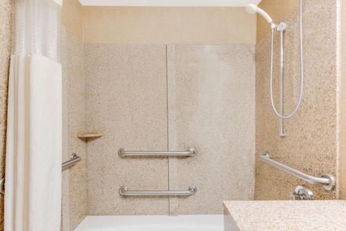 a shower in a bathroom with a shower curtain at Wingate by Wyndham - York in York