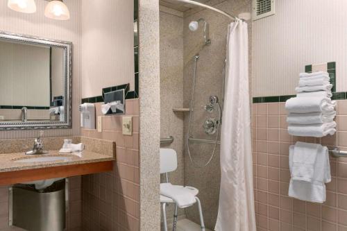 A bathroom at Ramada by Wyndham Bismarck