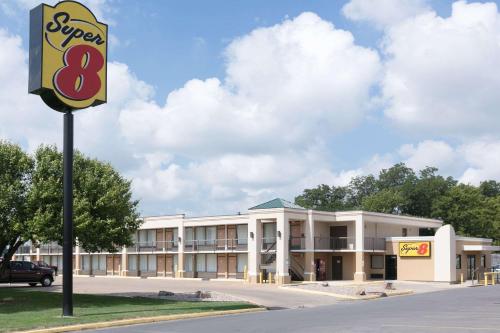 an office building with a burger sign in front of it at Super 8 by Wyndham Duncan in Duncan