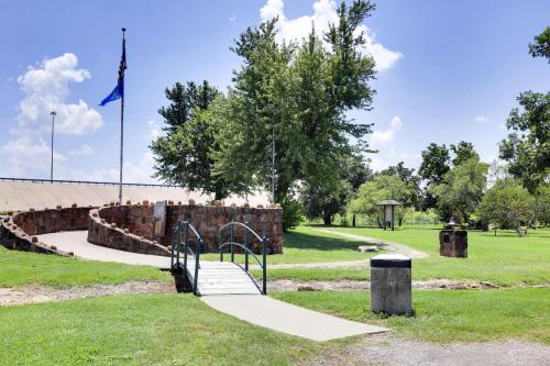 a playground in a park with a flag at Super 8 by Wyndham Duncan in Duncan