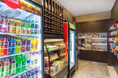 a refrigerator filled with lots of different types of drinks at Wingate by Wyndham Miami Airport in Miami