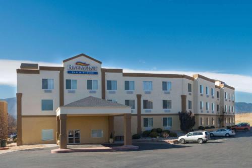 a large building with a sign on top of it at Baymont by Wyndham Colorado Springs in Colorado Springs