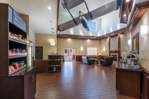 a large room with a lobby with a store at Baymont by Wyndham Colorado Springs in Colorado Springs