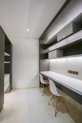 a dining room with a table and two chairs at The Penthouse KLCC in Kuala Lumpur