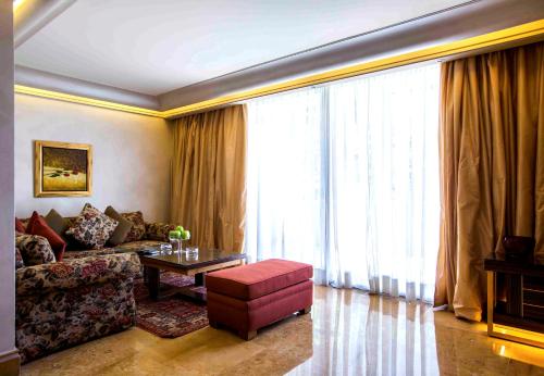 a living room with a couch and a table at Lahoya Beirut in Beirut