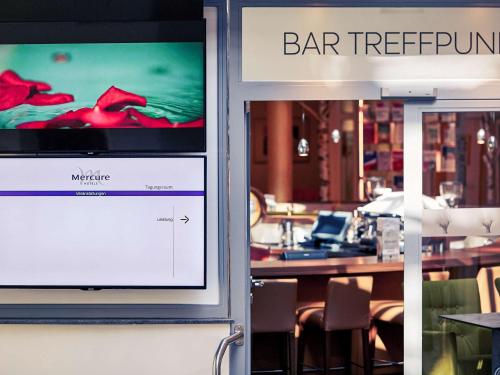 a sign in a restaurant with a barrington sign at Mercure Tagungs- & Landhotel Krefeld in Krefeld