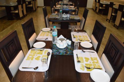 an overhead view of a table in a restaurant at Hotel Star Palace - Rameswaram Tamil Nadu in Rāmeswaram