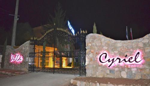 a gate in front of a building at night at Villa Cyriel in Contes