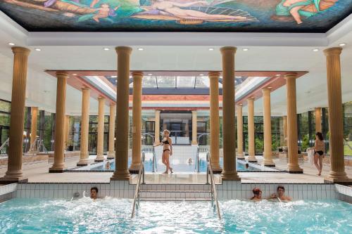 a group of people in a hot tub in a building at Amnéville centre touristique in Amnéville