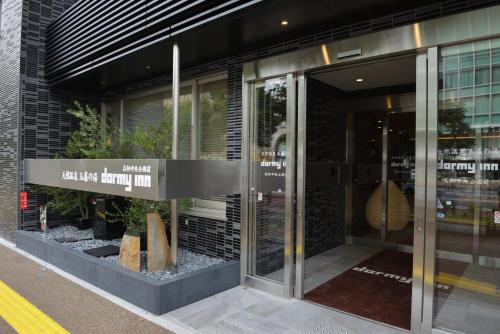 a store front of a building with glass doors at Dormy Inn Takamatsu Chuo Koenmae Natural Hot Spring in Takamatsu