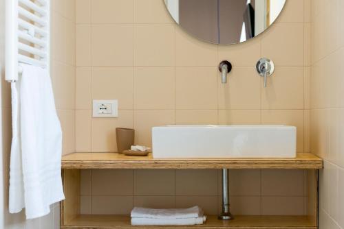 a bathroom with a white sink and a mirror at Il Grande Blu in Terracina